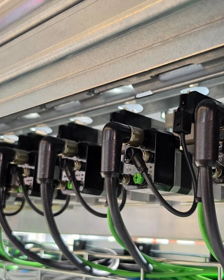 New Eckardt automatic nozzles in a row, each with its own connection, installed in a system.